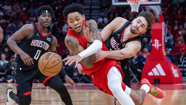 Trail Blazers guard Anfernee Simons (1) dribbles against Houston Rockets center Alperen Sengun (28) in the fourth quarter at Toyota Center.